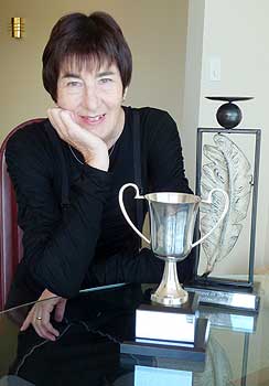 Professor Jill Hooks with her Lecturer of the Year  cup and quill trophy.